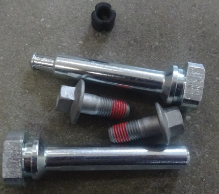 Front brake pin and locking bolt assembly